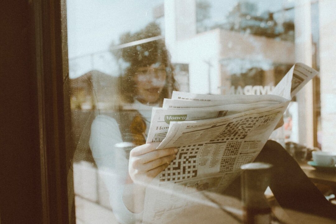 person reading newspaper
